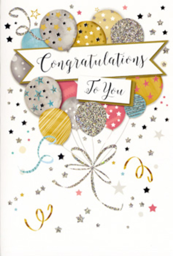 This image captures a refined congratulations card, shown upright against a soft, neutral backdrop, as if resting on a sideboard in a Harlesden living room after a party. The card's design is dominated by a bouquet of illustrated balloons that rise from the lower centre and fan outward in a gentle, upward arc. The balloons are rendered in a palette of muted metallics and pastels: warm gold, brushed silver, champagne beige, tranquil sky blue, tender blush pink, and soft, cloud-like grey. Each balloon is embellished with a different pattern-tiny glittering stars, fine sprinkles of shimmer, or slim, curved stripes-creating visual texture the way variety in petals and foliage does in a florist's arrangement at Harlesden Florist. Fine golden and silver ribbons hang from the base of the balloon cluster, curling and looping as they fall, their movement echoed by swirling decorative lines scattered across the card. Surrounding the main cluster, small stars, dots of confetti, and airy curves appear to float freely against the pale background, evoking the easy, joyful atmosphere of a celebration at home or a gathering near Harlesden's vibrant High Street. Spanning the centre of the design, a soft banner stretches horizontally across the balloons, gently curved so it appears to be held aloft by the buoyant shapes behind it. On this banner, "Congratulations To You" is written in flowing, calligraphic script, the lettering dark enough to be clearly legible yet graceful and light in its strokes. The interplay of metallic tones, pastel colours, and subtle sparkle gives the impression of quiet luxury, ideal for acknowledging achievements such as promotions, graduations, or new beginnings in Harlesden. Even without touching the card, you can almost sense the difference between the smooth printed surface and the slightly raised glitter on the balloons, making it a perfect partner to fresh flowers arriving by same-day delivery.